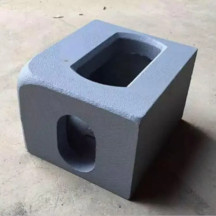 Close-up of a durable cast steel corner fitting for container stacking.