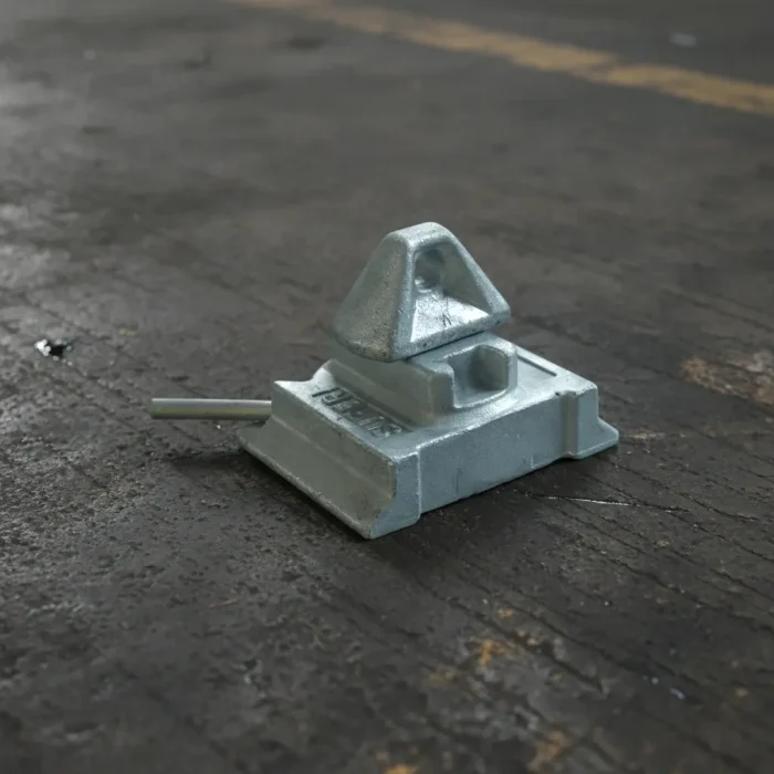Side-by-side comparison of different shipping container twist locks including chassis locks, stackers, and wheel mounting fittings.