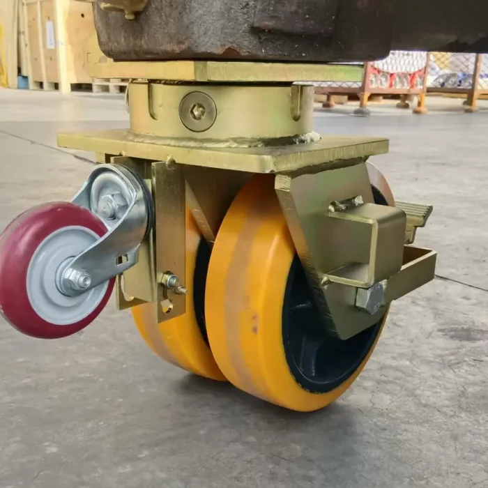 Mounted shipping container wheel in action during container relocation.